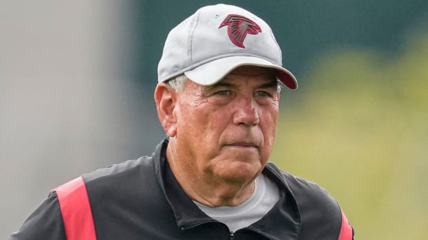 Atlanta Falcons defensive coordinator Dean Pees watches training camp.